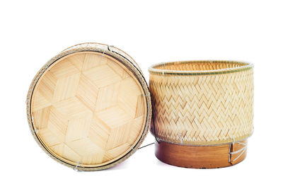 Close-up of sticky rice baskets against white background