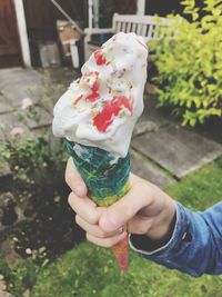 Hand holding ice cream cone