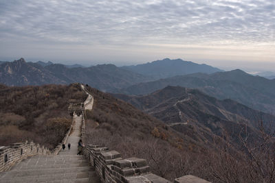 Scenic view of mountains against cloudy sky