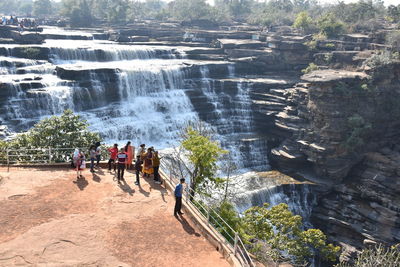 High angle view of people at waterfall