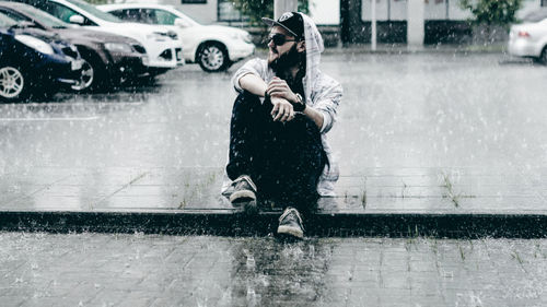 Full length of woman on wet street