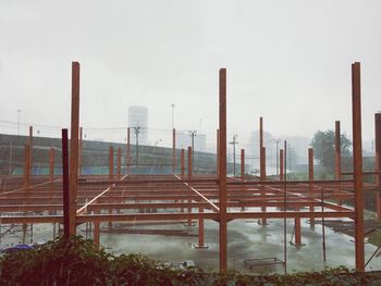 Construction site against sky during rainy season