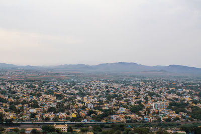 Aerial view of townscape against sky
