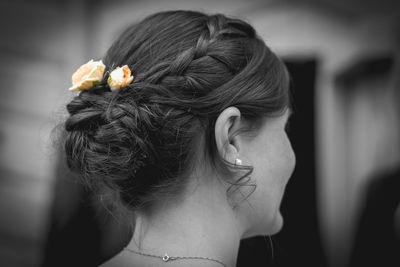 Close-up of woman wearing flowers in hair