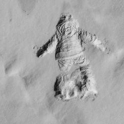 High angle view of shape on snow covered field during winter