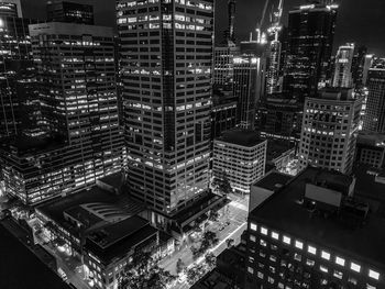 High angle view of illuminated buildings in city at night