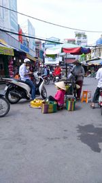 People at street market in city