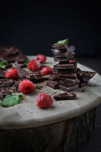 Close-up of chocolate with raspberry on table
