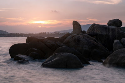 View of rock formation against sky during sunset