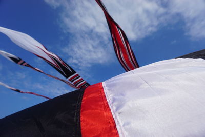 Low angle view of flag against sky