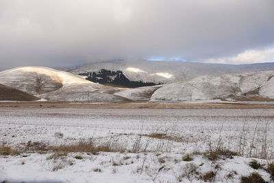 Scenic view of snowcapped mountains against sky