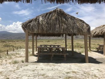 Built structure on field against sky