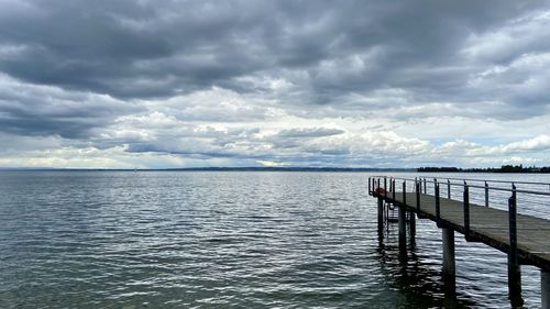 Pier over sea against sky