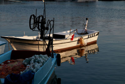 Fishing boats moored in lake