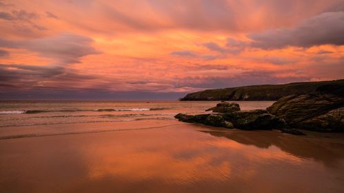 Scenic view of sea against dramatic sky