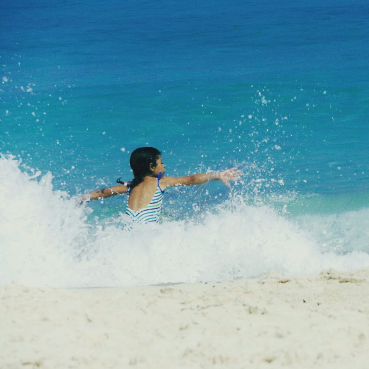 FULL LENGTH OF BOY ENJOYING ON BEACH