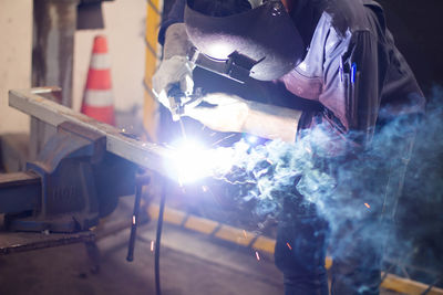 Man working on metal in workshop