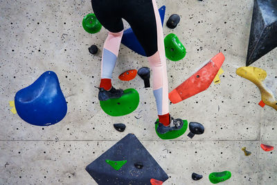 Woman training at bouldering gym. active recreation, sports exercises