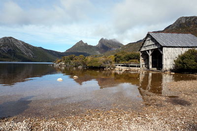 Scenic view of lake and mountains against sky