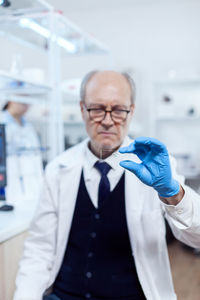 Portrait of young man standing in laboratory