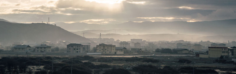 Buildings in city against sky