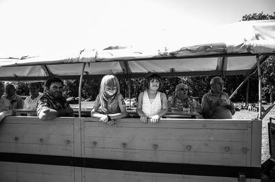 Group of people sitting outdoors