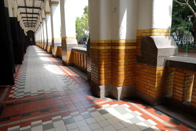 Footpath amidst buildings in city