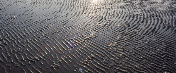 Full frame shot of raindrops on sand