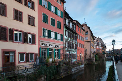 Residential buildings and houses in the old town of strasbourg, france with canal of river ill