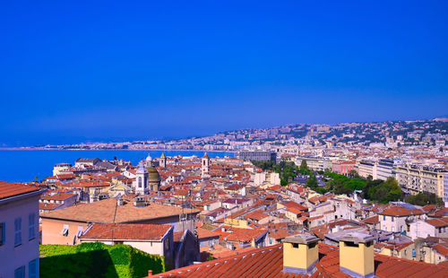 High angle shot of townscape against clear blue sky