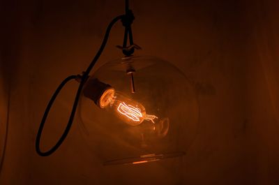 Close-up of illuminated light bulb