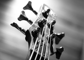 Cropped image of guitar on table