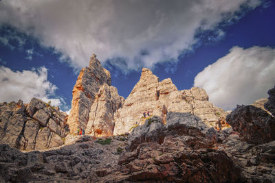 Low angle view of rocks against sky