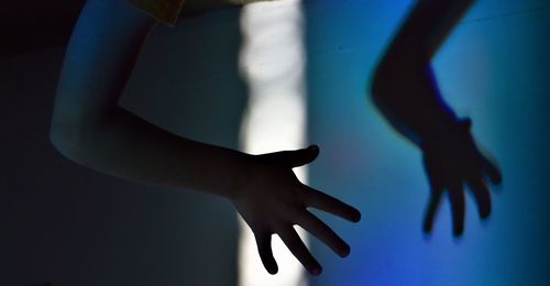 Close-up of woman hand on wall