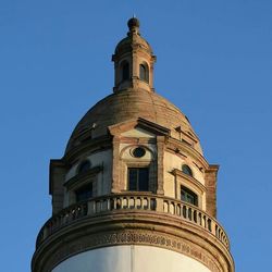 Low angle view of building against clear blue sky