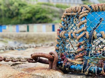 Close-up of fishing net at harbor