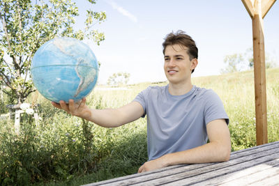 Portrait of boy playing soccer on field