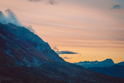 Scenic view of mountains against sky during sunset