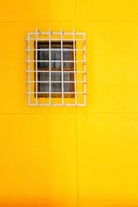 Low angle view of yellow wall