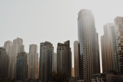 Low angle view of buildings against sky in city