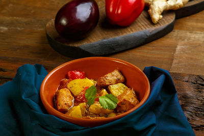 Food for suhoor in ramadan lamb stew with potatoes vegetables on a blue napkin. horizontal photo