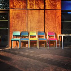 Empty chairs in illuminated room