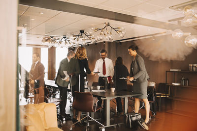 Legal colleagues leaving from board room at law office