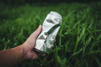 Cropped hand holding paper currency