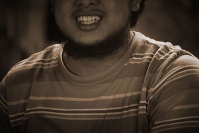 Close-up portrait of a smiling young man