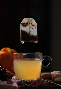 Close-up of coffee on table against black background