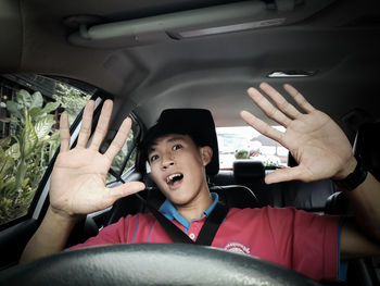 Portrait of boy sitting in car