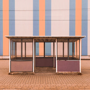 Empty bus station against wall