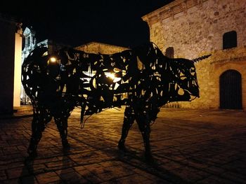 Silhouette of illuminated city at night