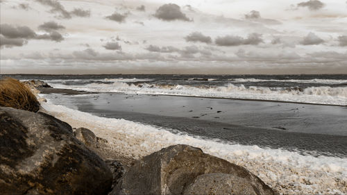 Scenic view of beach against sky